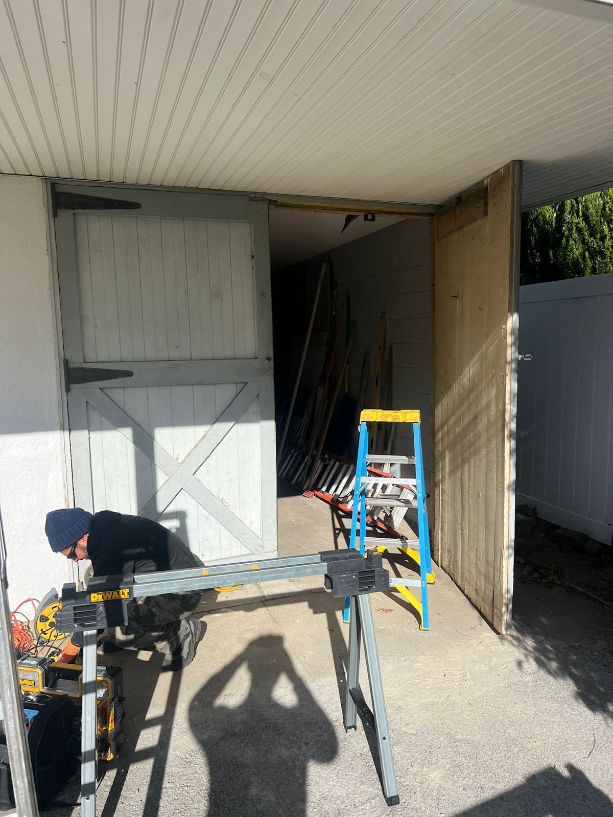 Technician working on barn-style door